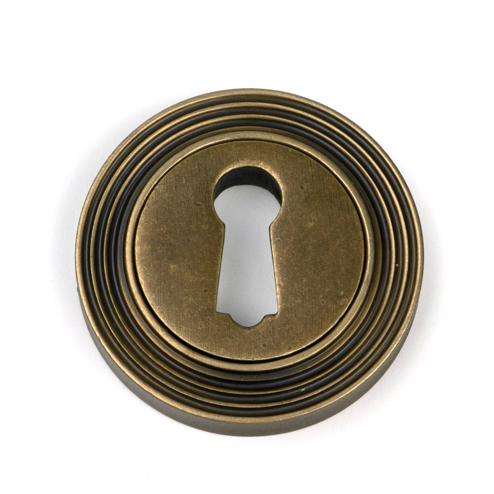 Burnished Brass Round Escutcheon (Beehive)